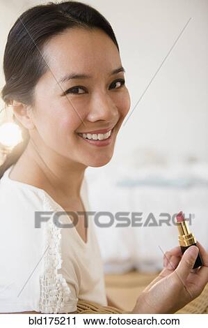 Chinese woman applying lipstick Stock Image | bld175211 ...