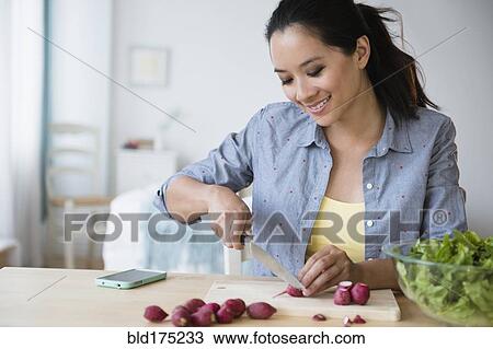 Chinese woman preparing salad View Large Photo Image Stock Image - Chinese woman preparing salad. Fotosearch