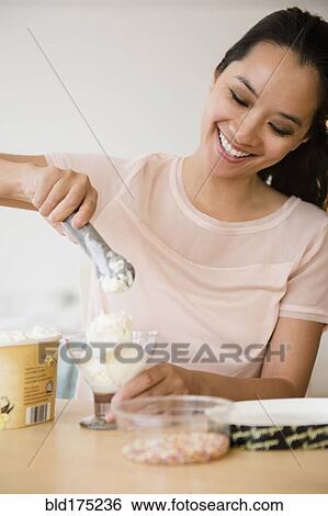 Chinese woman scooping ice cream View Large Photo Image Stock Photograph - Chinese woman scooping ice cream. Fotosearch