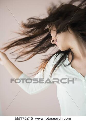Chinese woman tossing her hair View Large Photo Image Stock Photography - Chinese woman tossing her hair. Fotosearch