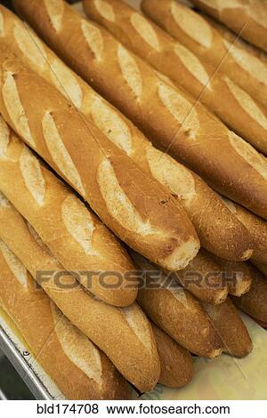 Stock Photo - Close up of pile of baguettes. Fotosearch