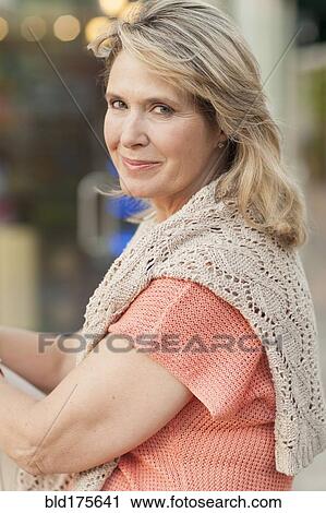 Stock Image - Close up of smiling Caucasian woman. Fotosearch