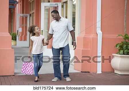 Father and daughter holding hands outdoors View Large Photo Image Picture - Father and daughter holding hands outdoors. Fotosearch
