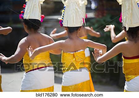 Stock Image - Girls dancing in traditional ceremony. Fotosearch