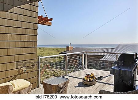 Stock Image - Grill and patio with ocean view. Fotosearch