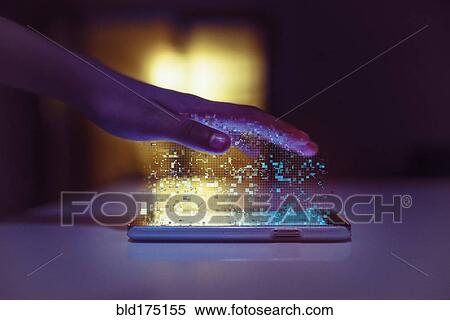 Stock Photography - Hand of mixed race communicating with cell phone. Fotosearch