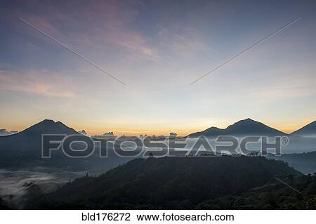 Stock Image - Hilltops over morning fog in remote landscape, Kintamani, Bali, Indonesia. Fotosearch
