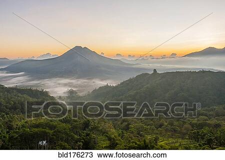 Hilltops over morning fog in remote landscape, Kintamani, Bali, Indonesia View Large Photo Image Stock Image - Hilltops over morning fog in remote landscape, Kintamani, Bali, Indonesia. Fotosearch