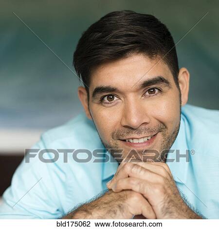 Stock Image - Hispanic man smiling. Fotosearch