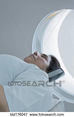 Hispanic patient laying in MRI machine View Large Photo Image Stock Photo - Hispanic patient laying in MRI machine. Fotosearch