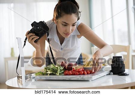 Hispanic woman photographing food View Large Photo Image Picture - Hispanic woman photographing food. Fotosearch