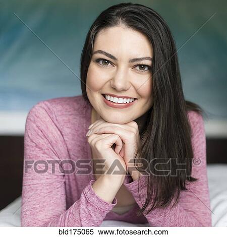 Hispanic woman resting chin in hands View Large Photo Image Stock Photography - Hispanic woman resting chin in hands. Fotosearch