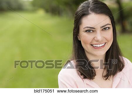 Hispanic woman smiling outdoors View Large Photo Image Stock Image - Hispanic woman smiling outdoors. Fotosearch