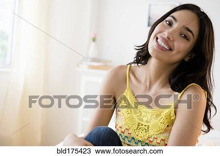 Stock Image - Hispanic woman smiling. Fotosearch