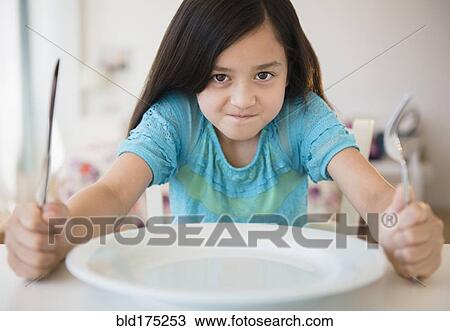 Hungry girl impatient for food View Large Photo Image Stock Image - Hungry girl impatient for food. Fotosearch