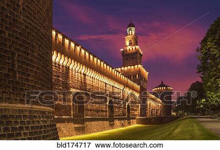 Stock Photo - Illuminated tower and castle walls, Milano, Lombardia, Italy. Fotosearch