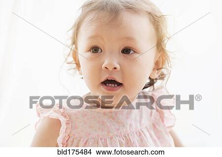 Picture - Mixed race baby girl with mouth open. Fotosearch
