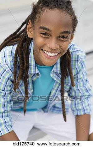 Mixed race boy smiling View Large Photo Image Stock Image - Mixed race boy smiling. Fotosearch