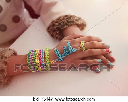 Mixed race girl wearing handmade jewelry View Large Photo Image Stock Photo - Mixed race girl wearing handmade jewelry. Fotosearch