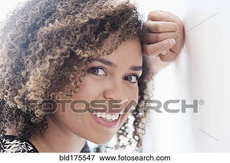 Stock Photo - Mixed race woman smiling. Fotosearch