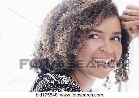 Stock Photo - Mixed race woman smiling. Fotosearch