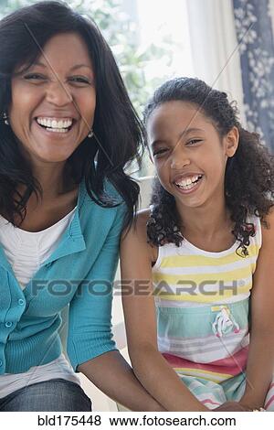 Stock Photo - Mother and daughter smiling. Fotosearch