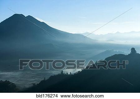 Picture - Mountains and morning fog in remote landscape, Kintamani, Bali, Indonesia. Fotosearch