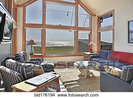 Picture - Ocean view through living room window . Fotosearch