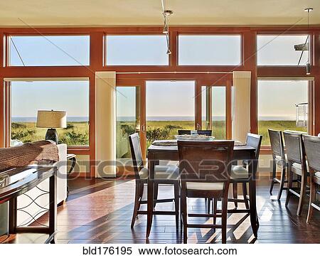 Stock Photography - Ocean view through window in dining room. Fotosearch