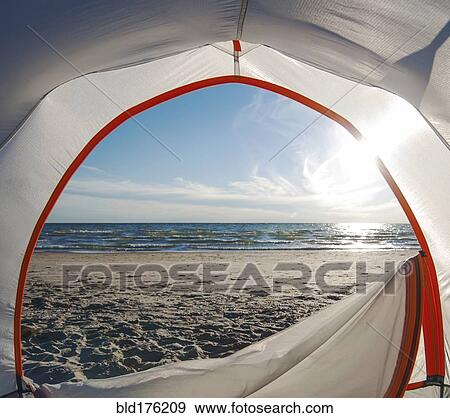 Stock Photo - Open camping tent door on beach. Fotosearch