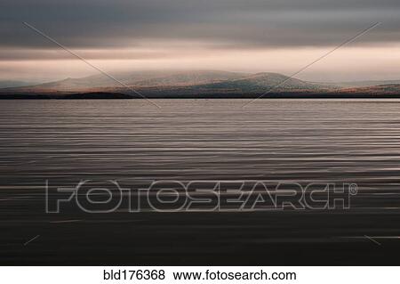 Rippling lake under clouds View Large Photo Image Stock Photo - Rippling lake under clouds. Fotosearch