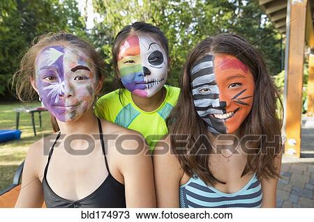 Smiling girls wearing face paint View Large Photo Image Stock Image - Smiling girls wearing face paint. Fotosearch