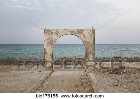 Stone arch over beach View Large Photo Image Stock Photography - Stone arch over beach. Fotosearch