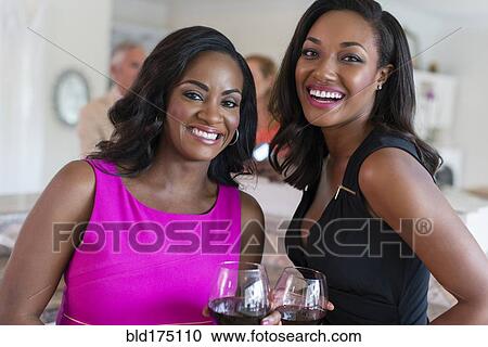 Women drinking wine at party View Large Photo Image Stock Image - Women drinking wine at party. Fotosearch