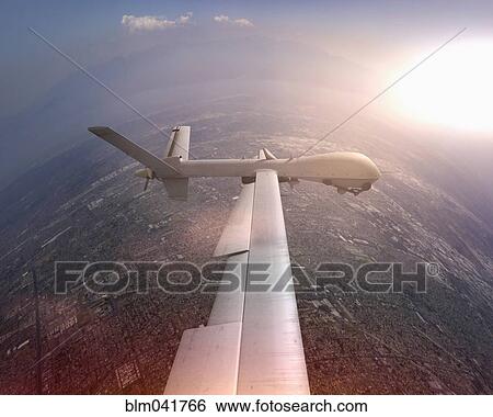 Stock Photograph - Aerial view of drone flying over cityscape. Fotosearch