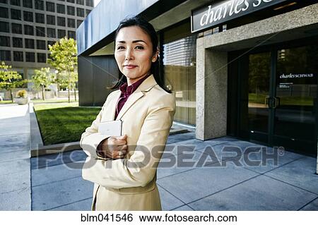 Asian businesswoman standing outdoors View Large Photo Image Stock Photograph - Asian businesswoman standing outdoors. Fotosearch