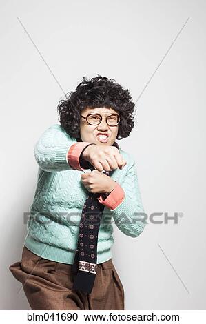 Asian woman punching air View Large Photo Image Stock Image - Asian woman punching air. Fotosearch