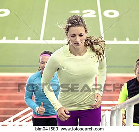 Athletes running up bleachers View Large Photo Image Stock Photo - Athletes running up bleachers. Fotosearch