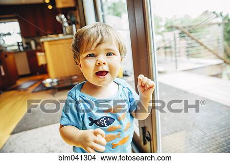 Baby boy walking in kitchen View Large Photo Image Picture - Baby boy walking in kitchen. Fotosearch