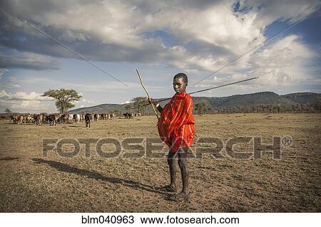 Black boy in traditional clothing standing in remote field View Large Photo Image Stock Image - Black boy in traditional clothing standing in remote field. Fotosearch