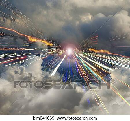 Blurred view of light trails in cloudy sky View Large Photo Image Stock Photo - Blurred view of light trails in cloudy sky. Fotosearch