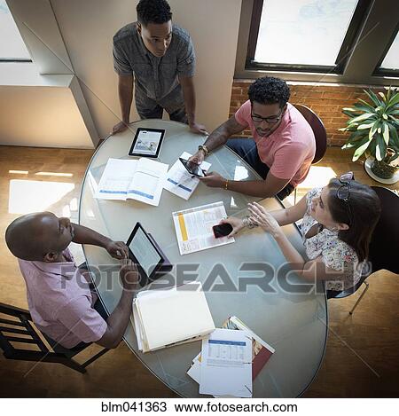 Business people talking in office meeting View Large Photo Image Stock Image - Business people talking in office meeting. Fotosearch