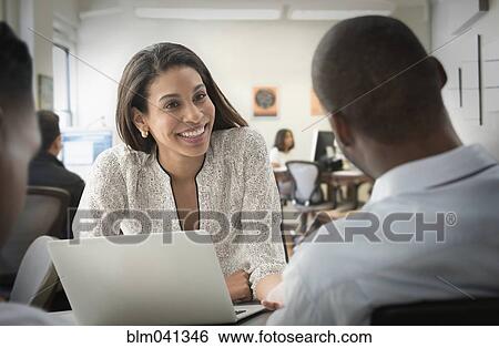 Business people talking in office View Large Photo Image Stock Photograph - Business people talking in office. Fotosearch