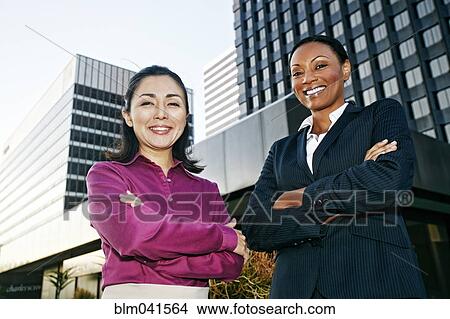 Businesswomen smiling outdoors View Large Photo Image Picture - Businesswomen smiling outdoors. Fotosearch