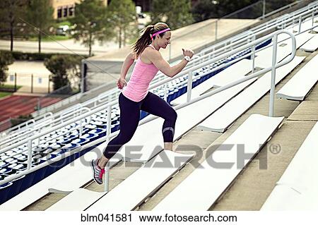 Caucasian athlete running up bleachers View Large Photo Image Stock Image - Caucasian athlete running up bleachers. Fotosearch