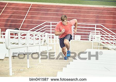 Caucasian athlete running up bleachers View Large Photo Image Stock Photo - Caucasian athlete running up bleachers. Fotosearch