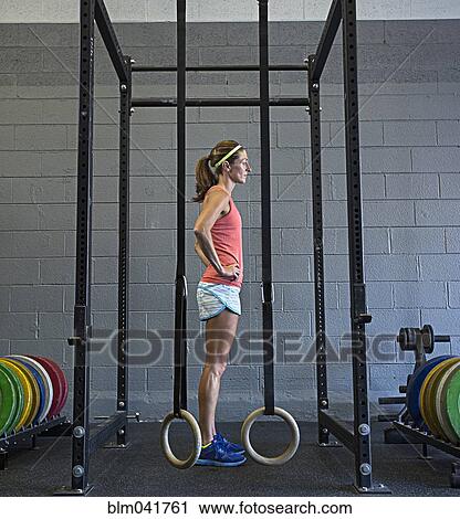 Caucasian athlete standing in gym View Large Photo Image Stock Image - Caucasian athlete standing in gym. Fotosearch