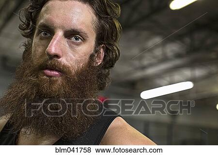 Caucasian athlete standing in gym View Large Photo Image Stock Photo - Caucasian athlete standing in gym. Fotosearch
