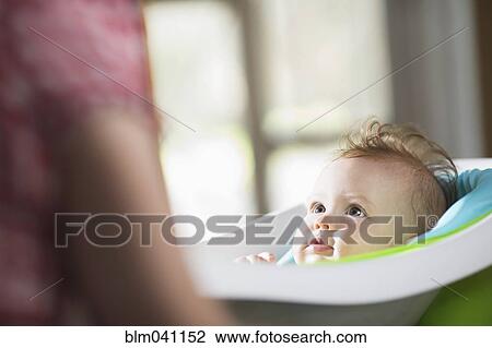 Caucasian baby girl laying in bath View Large Photo Image Stock Image - Caucasian baby girl laying in bath. Fotosearch