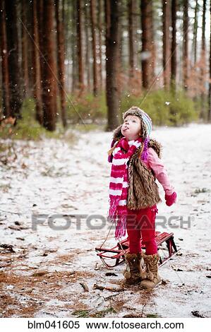 Caucasian girl catching snow on tongue View Large Photo Image Stock Photography - Caucasian girl catching snow on tongue. Fotosearch